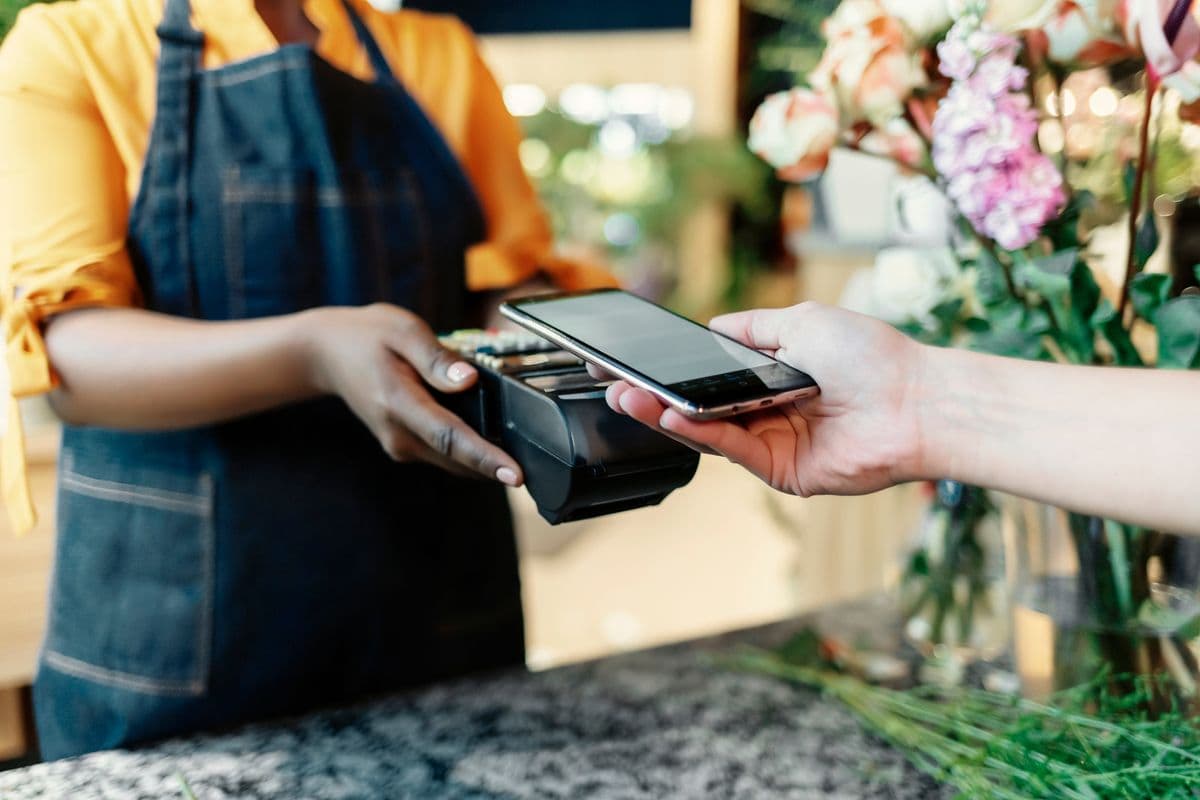 Business owner accepting a contactless card payment