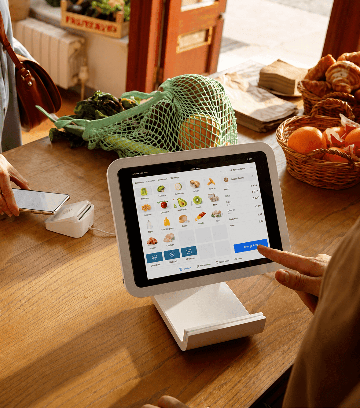 Business owner checking out a customer with a POS terminal